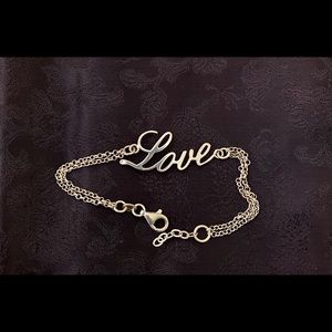 Silver “Love” bracelet